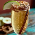 easy apple cider mimosa with cinnamon sugar rim - featured image
